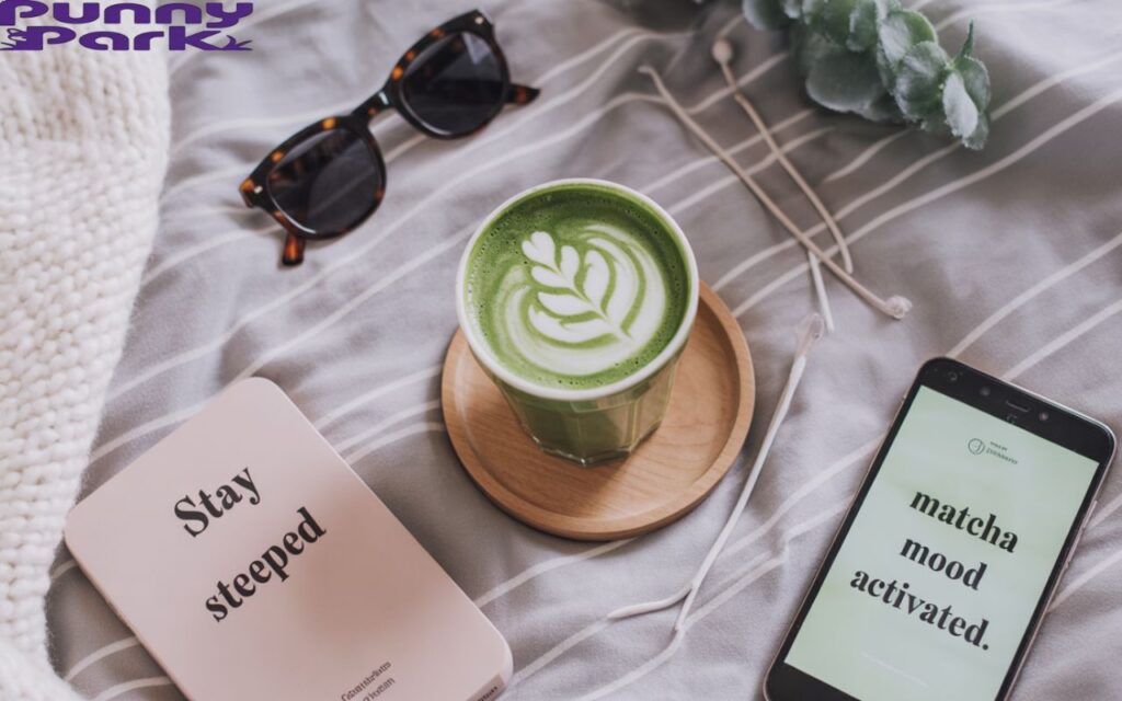 A flat-lay shot with a matcha latte in a trendy cup, sunglasses, phone, and captions like “Stay steeped” and “Matcha mood activated.” Cozy, influencer-style setup.